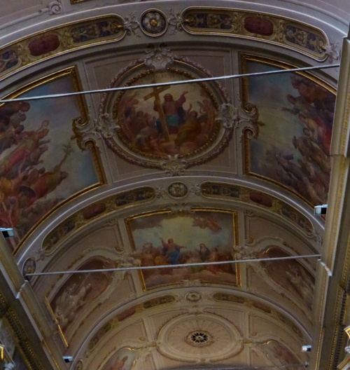 The ceiling and much of the walls are covered in murals.
